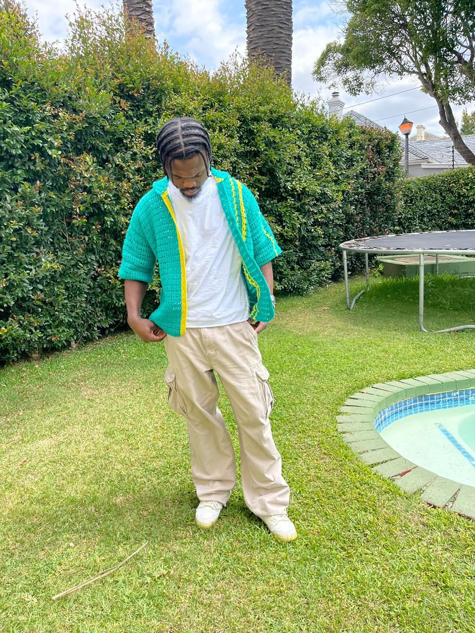 Man wearing a handcrafted crochet top